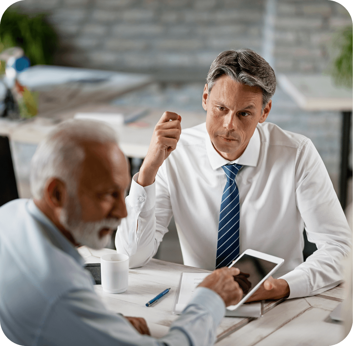 Two business owners discussing accounting details